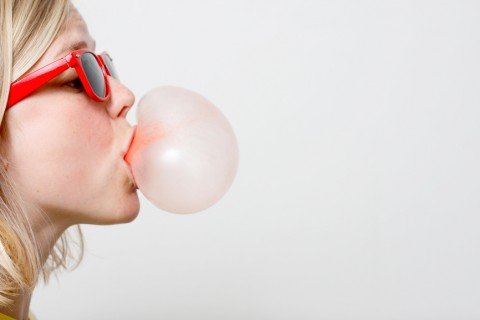 Girl playing with gum