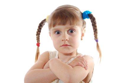 portrait, of a little girl with stubborn facial expression