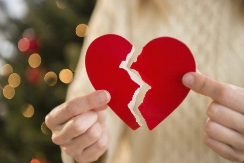 Studio Shot of female's hands holding broken heart